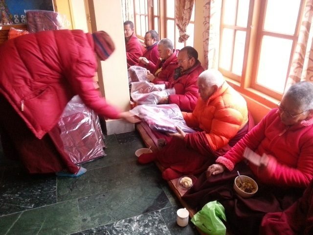 These are nuns and monks receiving robes purchased with donations.