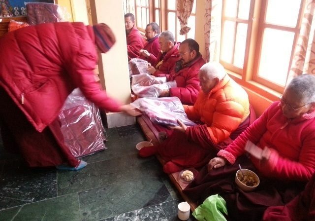 These are nuns and monks receiving robes purchased with donations. 